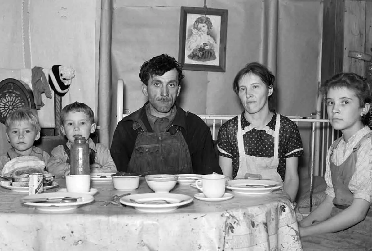 family eating simple dinner great depression 1930s