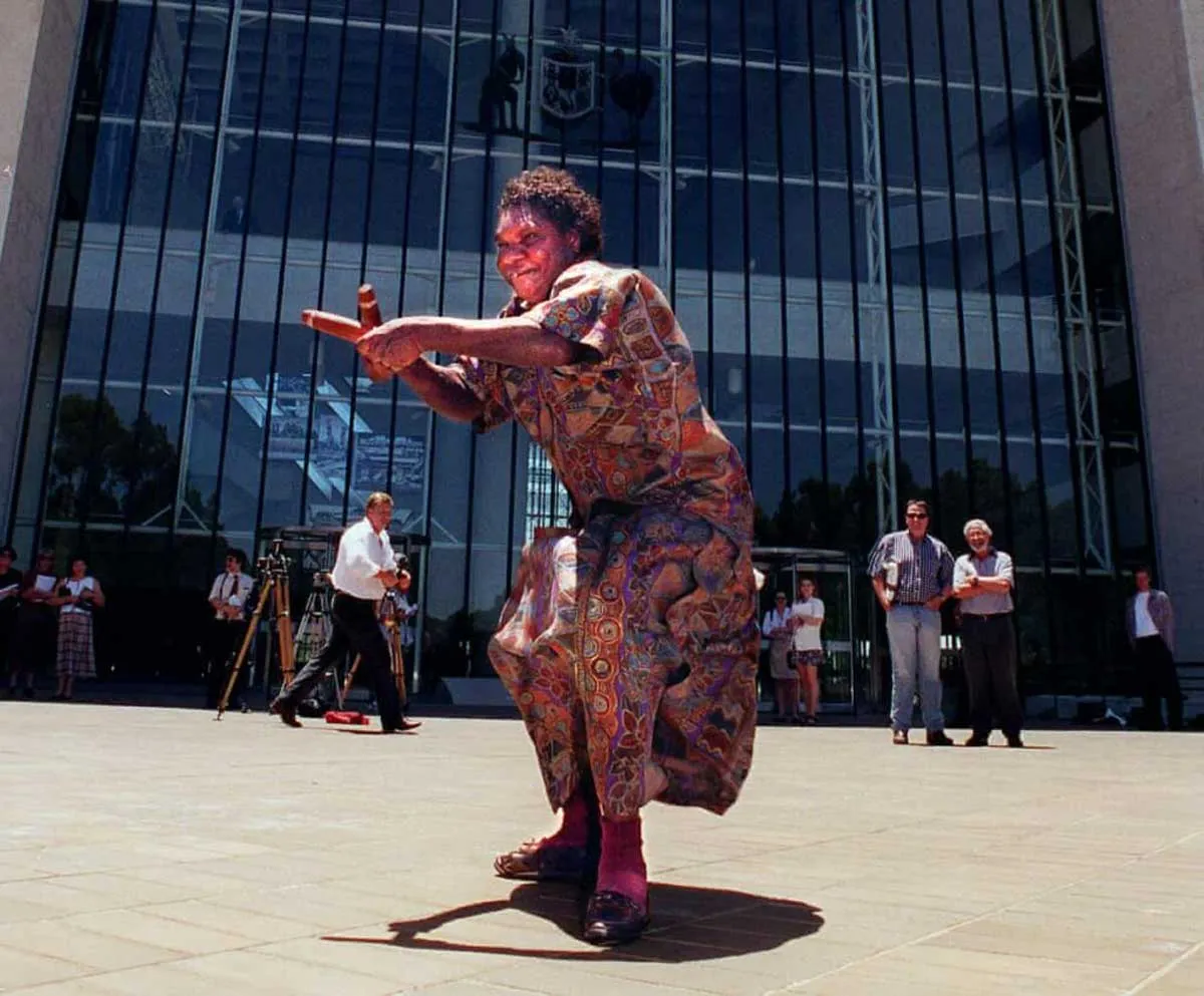 woman dancing outside high court aboriginal land rights