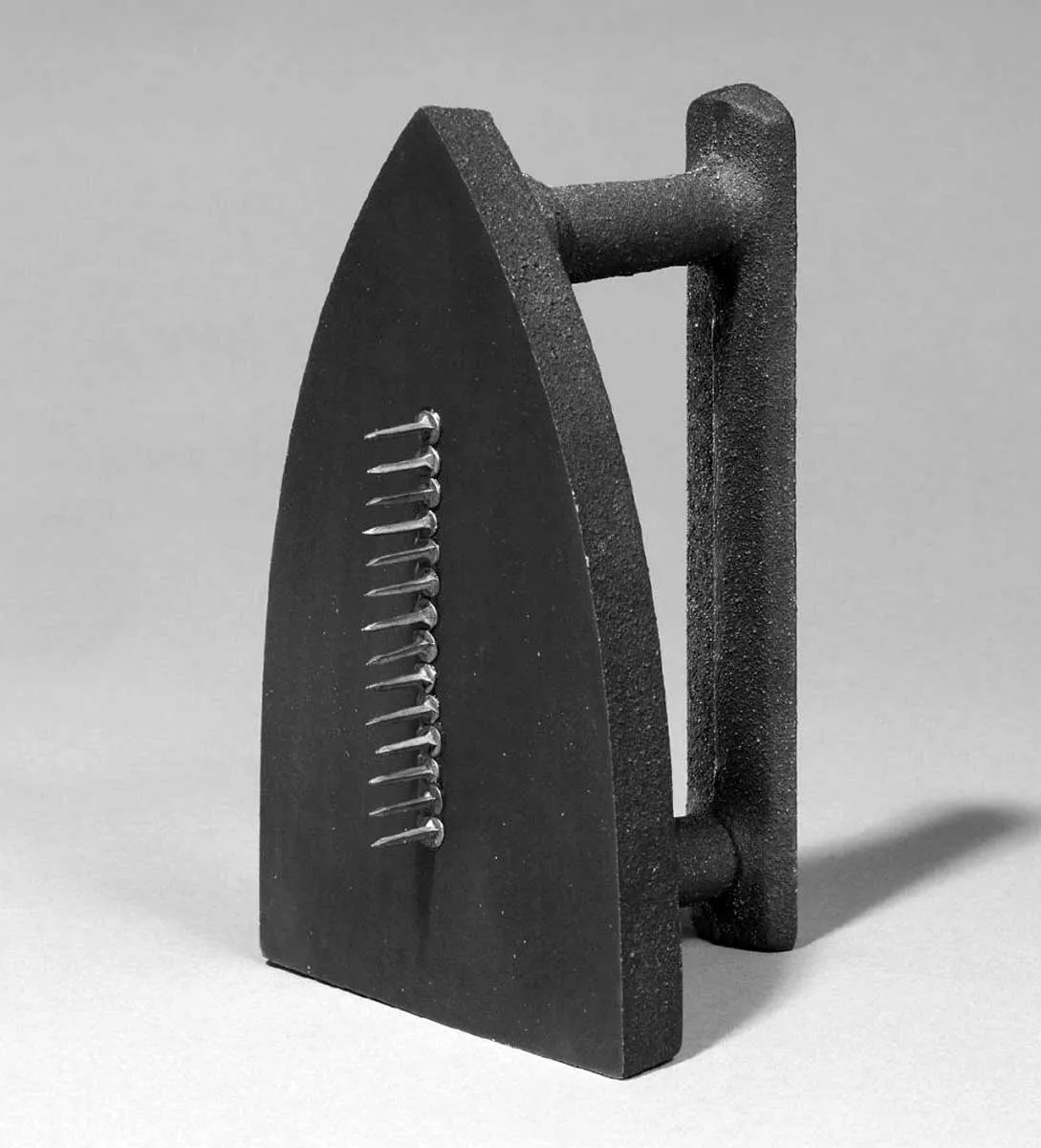 found object man ray gift iron